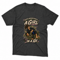 A dark charcoal gray graphic t-shirt featuring an illustration of a woman in Brazilian Jiu-Jitsu (BJJ) gear with the text 'NEVER UNDERESTIMATE A GIRL IN A GI'. The shirt is displayed flat against a clean white background.