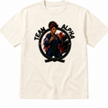 An off-white crewneck t-shirt featuring a graphic print of a martial arts fighter inside a circle with the text 'TEAM ALPHA' on a plain white background.