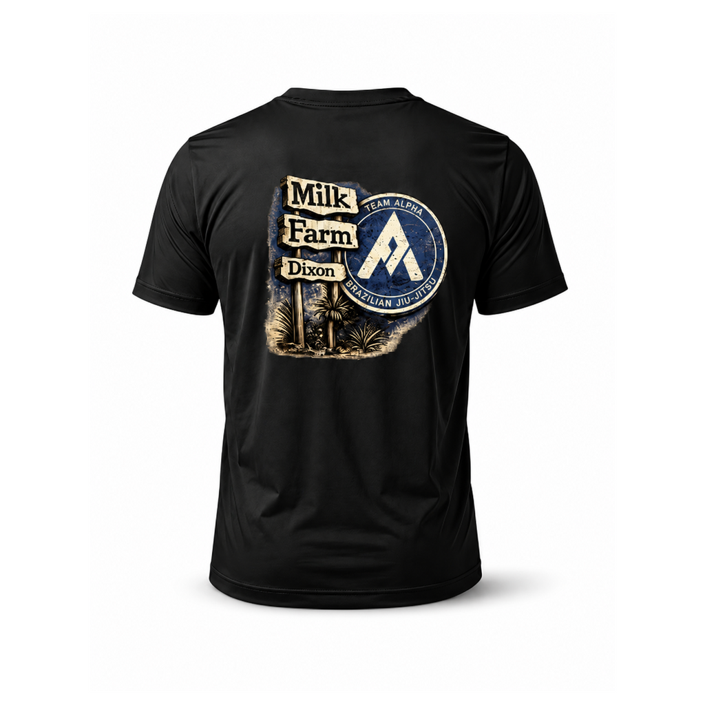 A black short-sleeve t-shirt shown from the back, featuring a large graphic print on the center back with a vintage-style 'Milk Farm Dixon' sign and a circular 'TEAM ALPHA' emblem.