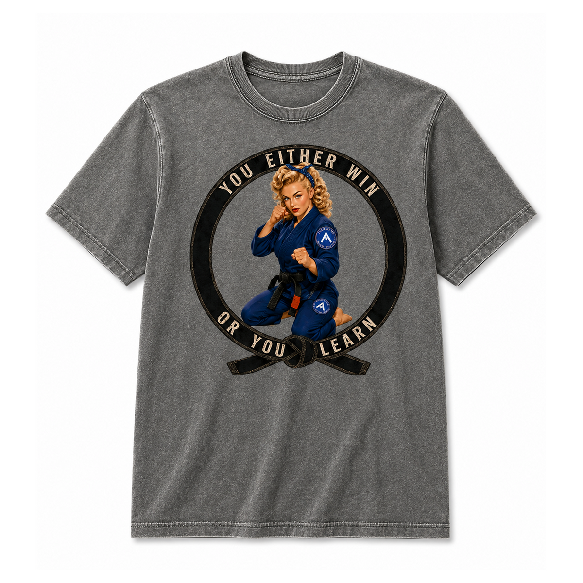 A gray acid-wash t-shirt featuring a circular graphic of a Brazilian Jiu-Jitsu (BJJ) woman in a blue gi with a black belt. The graphic includes the text 'YOU EITHER WIN OR YOU LEARN' in beige.